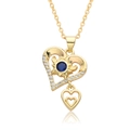 Detail of 18k gold heart pendant with blue gemstone and zircon accents on a fine chain - Double Heart Blue Stone Style (c551)
