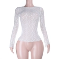 Close-up of white sheer floral lace fabric with intricate patterns on a long sleeve top - S / White