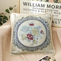 Champagne floral embroidered cushion pillow with pom-pom fringe on a textured fabric - Blue