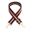 Detail of red and gold striped fabric strap with polished gold metal buckles and texture - Burgundy