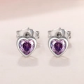 Detail of purple heart stud earrings with silver metal base and heart-shaped gemstone - Purple