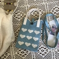 Blue knitted phone bag with white heart pattern and detachable shoulder strap - Blue Heart Black Button