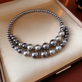 Detail of a vintage double-row grey pearl necklace in a premium brown leather jewelry box - Grey Pearl (6-14mm)