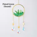 Plated green crystal suncatcher with golden moon ring and rainbow prism pendant - Electroplated Green Crystal Rolling Stone Cluster Round Wind Chime