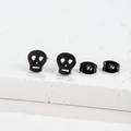 Matte black skull earrings for women with heart-shaped eye hollows and metal backings - Skull / Black