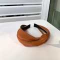 Cross-knot headband in soft caramel leather featuring a comfortable non-slip inner lining - Maple Orange