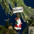Christmas Welcome sign ornament with Santa Claus and bronze bell hanging on pine tree - Santa Claus Welcome Sign with Christmas Tree
