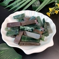 Natural rectangular stone crystal pendants in deep green and brown on a shell tray - Indian Agate