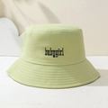 Detailed close-up of Babygirl gothic letter embroidery on light green bucket hat - One Size / Bean Green