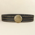 Detail of a wide black PU leather boho belt with bronze embossed floral buckle and eyelets - 731 Style / Black
