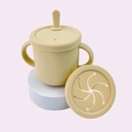 Pale yellow baby silicone training cup with double handles and interchangeable lids - Off White
