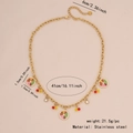 Golden stainless steel necklace featuring colorful enamel citrus and bead pendants - Citrus Platter Necklace