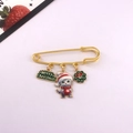 Detail of Christmas cat brooch with Merry Christmas pendant and green wreath - Cat Holding Decor Ball with Green Wreath