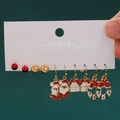 5-pair Christmas earring set with Santa Claus, wreath, and gift box charms on green background - 50 Santa Gift Box Wreath (5 Pairs Set)