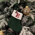 Green knitted Christmas stocking with embroidered red letter E on a white cuff - Green/Letter E