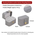 Grey faux leather mini travel ring box with four slots and a gold button closure - Gray