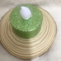 Green glitter LED tea light candle placed on a natural wood slice for romantic decor - 3.7*2CM / Green