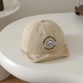 Detail of embroidered cartoon puppy and artistic lettering on beige soft brim baby cap - 48-50cm (1-2 Years) / Khaki