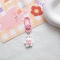 Cute white bunny keychain with pink bow and metal clip on decorative background - White Bow Rabbit