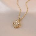 Elegant gold layered flower pendant necklace with clear cubic zirconia inlay details - Clover Necklace / Gold
