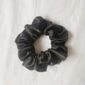 Classic black satin scrunchie with a glossy silk finish and elastic pleated design - Black