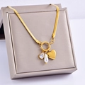 Gold snake chain necklace with heart, zircon and pearl pendants in a jewelry box - Heart Pearl Style