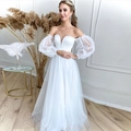 Elegante off-shoulder trouwjurk met pofmouwen en een zwierige A-lijn rok van tule stof - US size 2 (S) / Ivoor