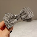 Close-up of sparkling rhinestone bow hair clip with silver alloy base for women - Style A Hair Clip / White