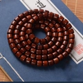 Polished dark red sandalwood 108 barrel beads bracelet on a vintage book - Barrel Beads 8mmx8mm*108 Beads