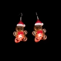 Luminous LED gingerbread man earrings with warm red glow and orange acrylic finish - Gingerbread Man Earrings