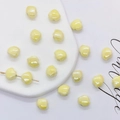Pearlescent light yellow shell shaped ceramic beads for DIY jewelry making and bracelets - 12mm / Light Yellow