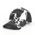 Detail view of tie-dye cotton baseball cap featuring black and white graffiti print - Adjustable (54-60cm) / Black