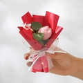 Handmade knitted pink flower bouquet wrapped in red paper and white mesh with a ribbon - Knitted Pink Tulip