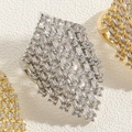Macro shot of silver and gold geometric rings with sparkling cubic zirconia inlay - Square Zirconia Style White Gold / Silver
