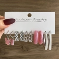 Five-pair earring set featuring pink butterfly charms, pearls, and resin hoops held by hand - 5 Pairs Set-Pink Butterfly Pearl Chain