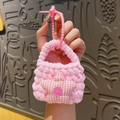 Pink handmade crochet mini earphone case with a red checkered star pattern - Pentagram Decor (Pink)