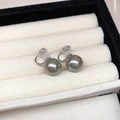 Macro shot of grey pearl clip-on earrings with soft silicone pads in a black jewelry box - 35# Ear Clip - Silver Grey Pearl - 14mm