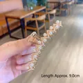 Elegant 9.0cm gold-tone metal hair claw clip with crisscross design and faux pearls - Wave Pearl