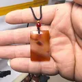 Handheld red agate rectangular pendant necklace with black woven cord and decorative beads - Small Plaque Cord with Gold Bead