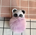 Detail of cute panda plush keychain with a soft purple fluffy fur ball and metal ring - Purple
