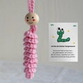 Handmade pink crochet worry worm with smiling wooden bead and German gift card - Pink Lucky Worm
