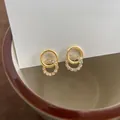 Élégantes boucles d'oreilles créoles dorées entrelacées avec zircons cubiques scintillants - Clip d'Oreille Spirale (Sans Trou) / Doré