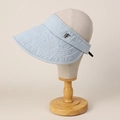 Close-up of light blue denim sun hat with metal logo and wide brim for UV protection - M (56-58cm) / Light Blue