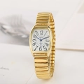Vintage women's tonneau quartz watch with gold stretch band and bold Arabic numerals - Women's Gold