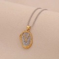 Macro detail of a gold V-letter pendant set with clear crystals on a silver ball chain - Letter V