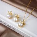 Elegant gold pearl crown necklace and earrings jewelry set on a satin background - Set / Gold