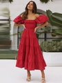 Close-up of red off-shoulder maxi dress with puff sleeves and tiered skirt detail - Red