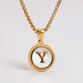 Detailed view of golden pendant necklace with white shell inlay and letter Y engraving - Letter Y