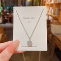 Close-up of square heart pendant necklace with zircon stone on white display card - Silver (Square Clear Gem)