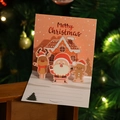 3D pop-up Christmas card featuring Santa and reindeer with lined writing space - Model H664 (Gingerbread Town)